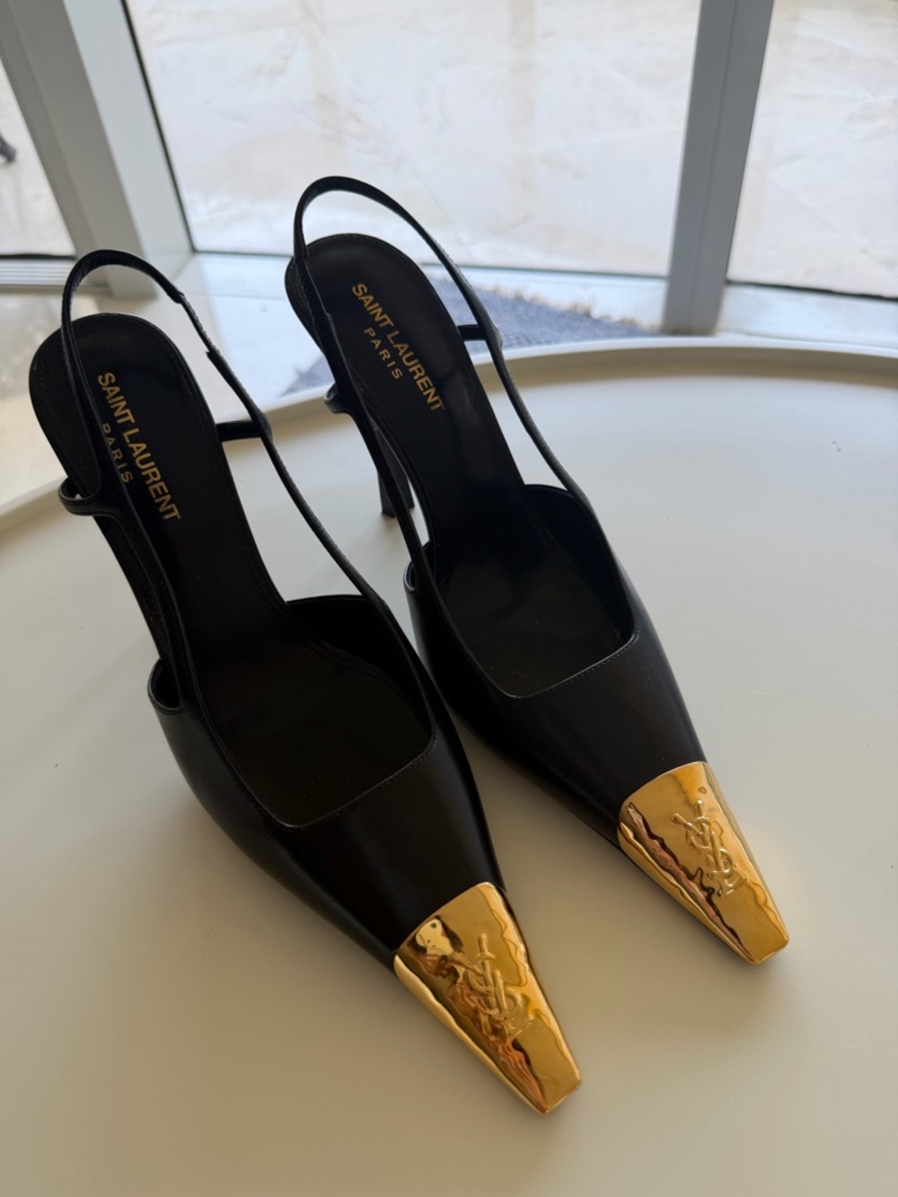 Saint Laurent Black Leather Slingback Pumps with Gold Toe Caps